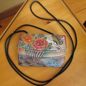 Anuschka organizer wallet on a string